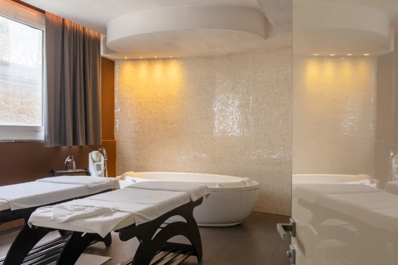Spa treatment area with massage beds and soaking tub for deep relaxation in Sarzana, Liguria - Sarzana Park Hotel, BZAR hotels in Liguria