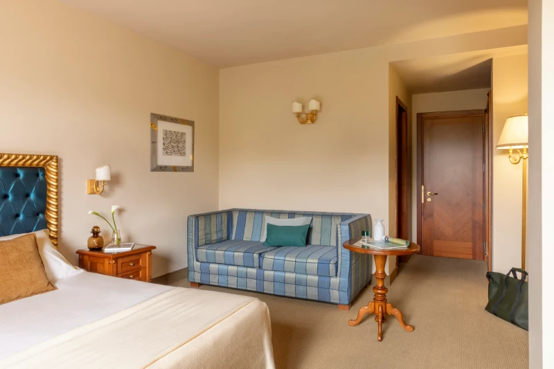 Superior room with sofa lounge area, side table and classic furnishings for business or leisure in Sarzana, Liguria - Sarzana Park Hotel, BZAR hotels in Liguria